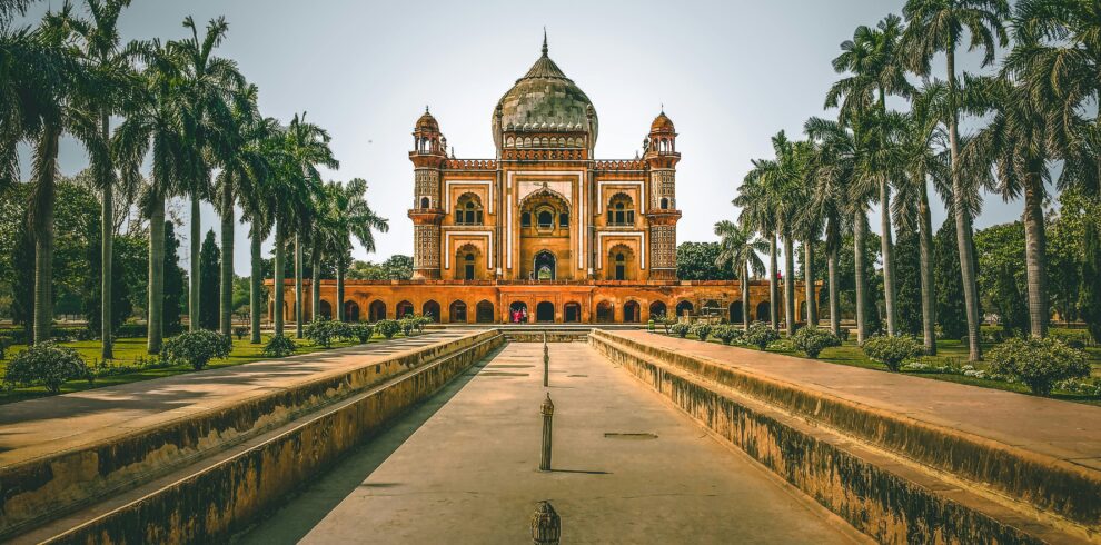 Explore the stunning Safdarjung Tomb in New Delhi, India, surrounded by lush gardens and palm trees.